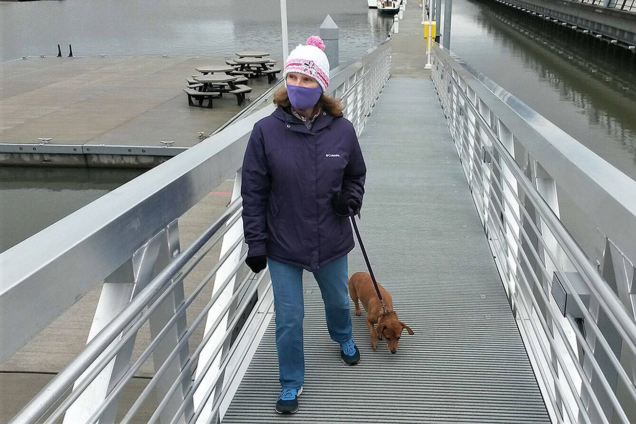 Julie Muhlstein and her dog, Oscar, out for a walk last week at the Everett waterfront. (Contributed photo)