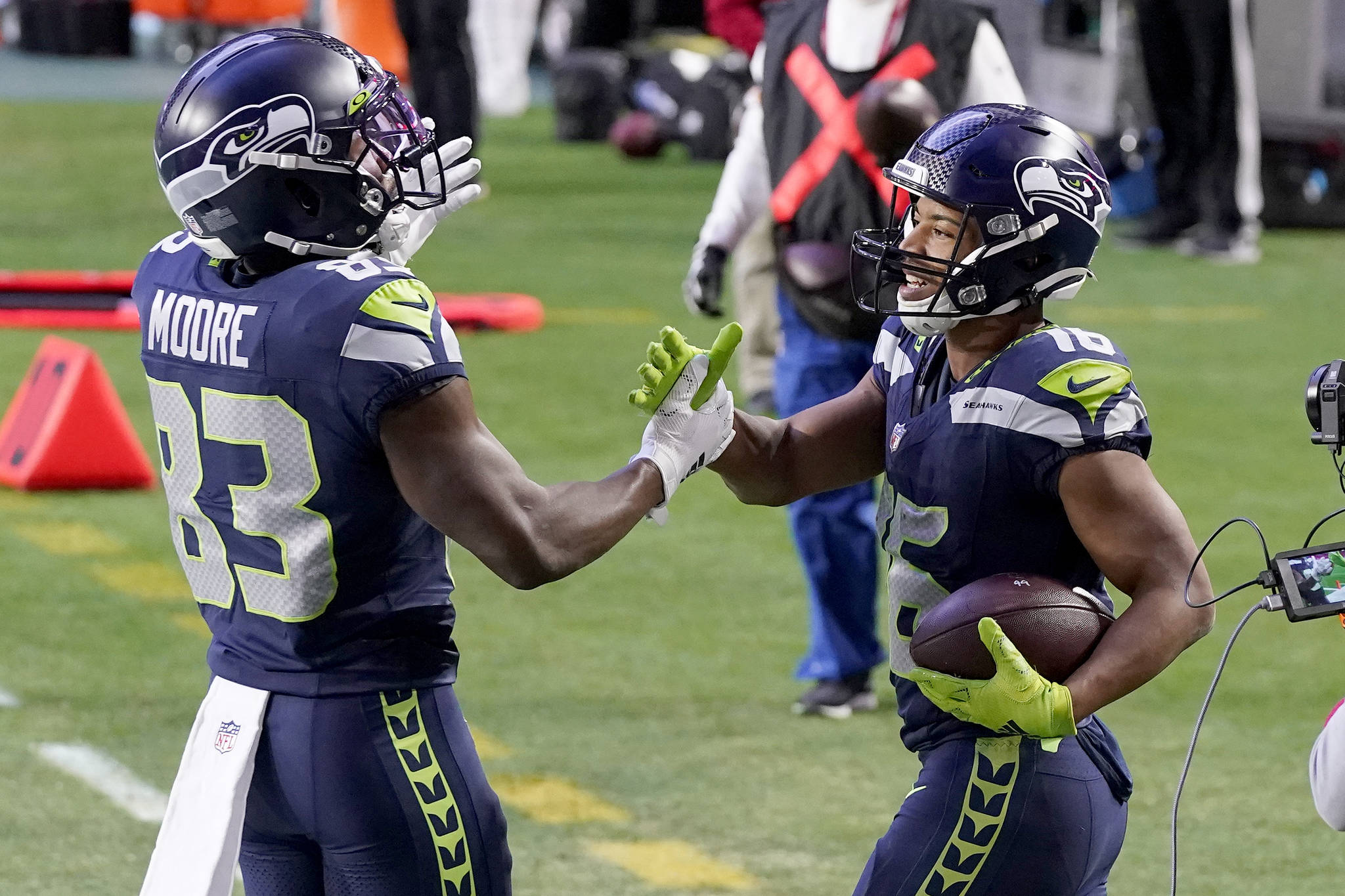 Seattle Seahawks wide receiver Tyler Lockett (16) celebrates with David Moore (83) following Lockett’s fourth-quarter touchdown against the San Francisco 49ers Sunday in Glendale, Ariz. (AP Photo/Ross D. Franklin)