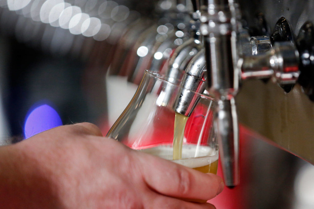 A beer pour at Everett-based Crucible Brewery’s taphouse. Crucible recently released its first bottled barrel-aged sour. (Kevin Clark / The Herald) 
