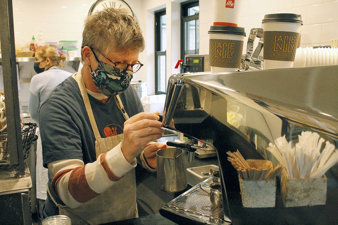 Annabelle Richardson pours a latte at Langley Kitchen. (Kira Erickson / Whidbey News-Times)