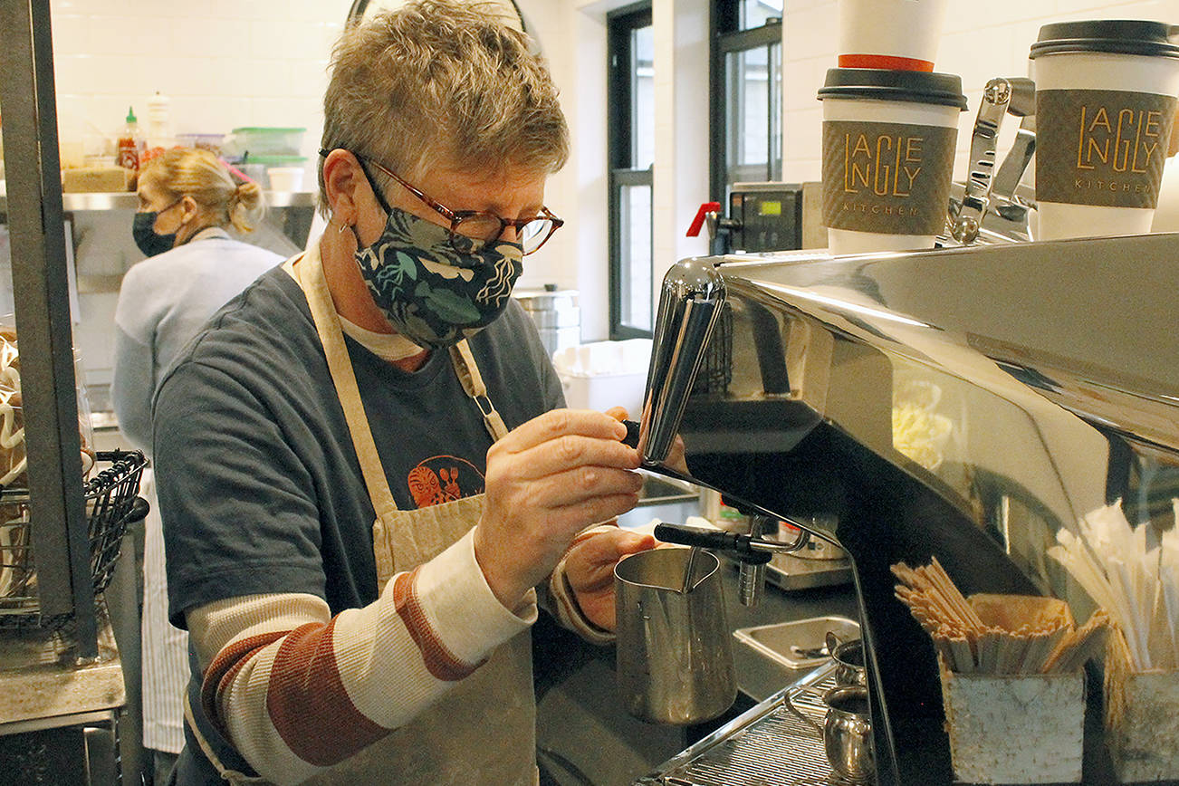 Annabelle Richardson pours a latte at Langley Kitchen. (Kira Erickson / Whidbey News-Times)