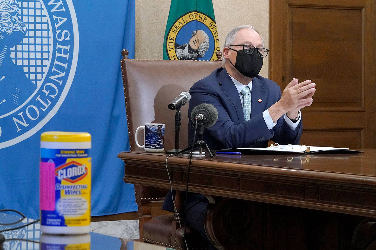 Washington Gov. Jay Inslee speaks at a news conference Tuesday at the Capitol in Olympia. (AP Photo/Ted S. Warren)