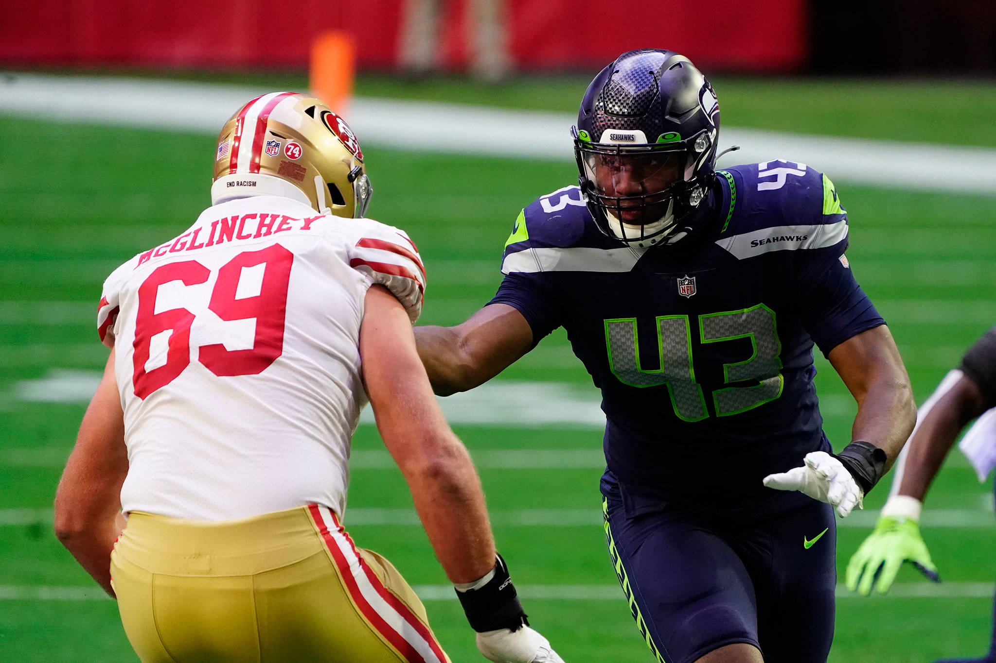 Seahawks defensive end Carlos Dunlap (43) rushes the passer against 49ers offensive lineman Mike McGlinchey during on Jan. 3, 2021, in Glendale, Ariz. (AP Photo/Rick Scuteri)