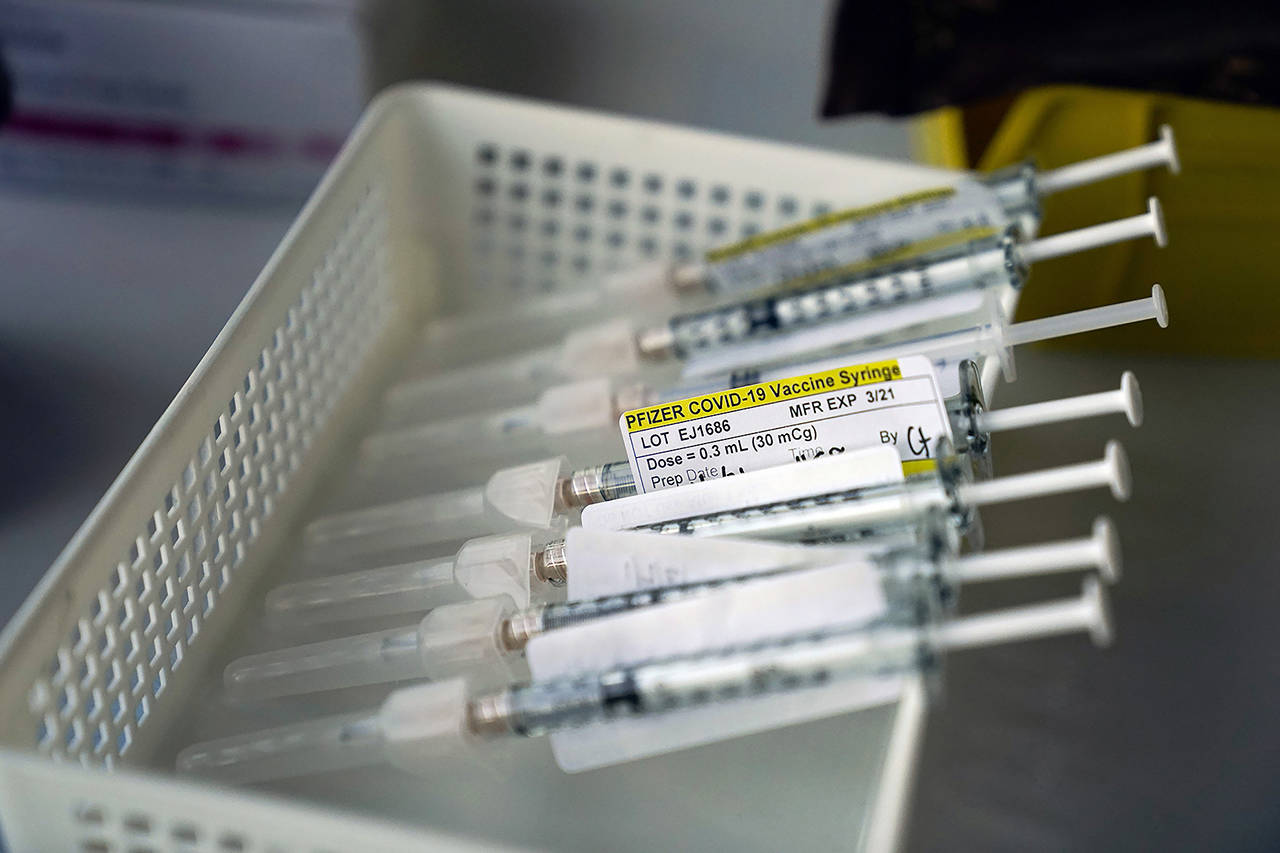 Syringes containing the Pfizer-BioNTech COVID-19 vaccine at St. Joseph Hospital in Orange, California. (AP Photo/Jae C. Hong, File)