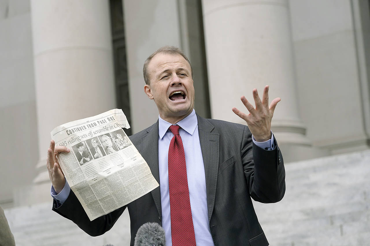 Tim Eyman talks to reporters Oct. 15, 2020, in front of the Temple of Justice at the Capitol in Olympia. (AP Photo/Ted S. Warren, file)
