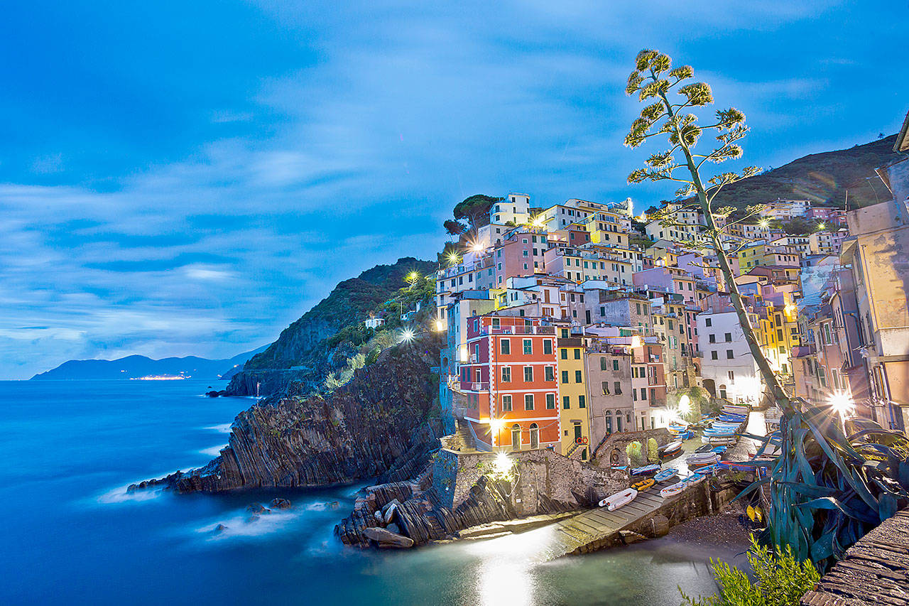 Riomaggiore, one of the Cinque Terre towns, is aglow at night. (Rick Steves’ Europe)