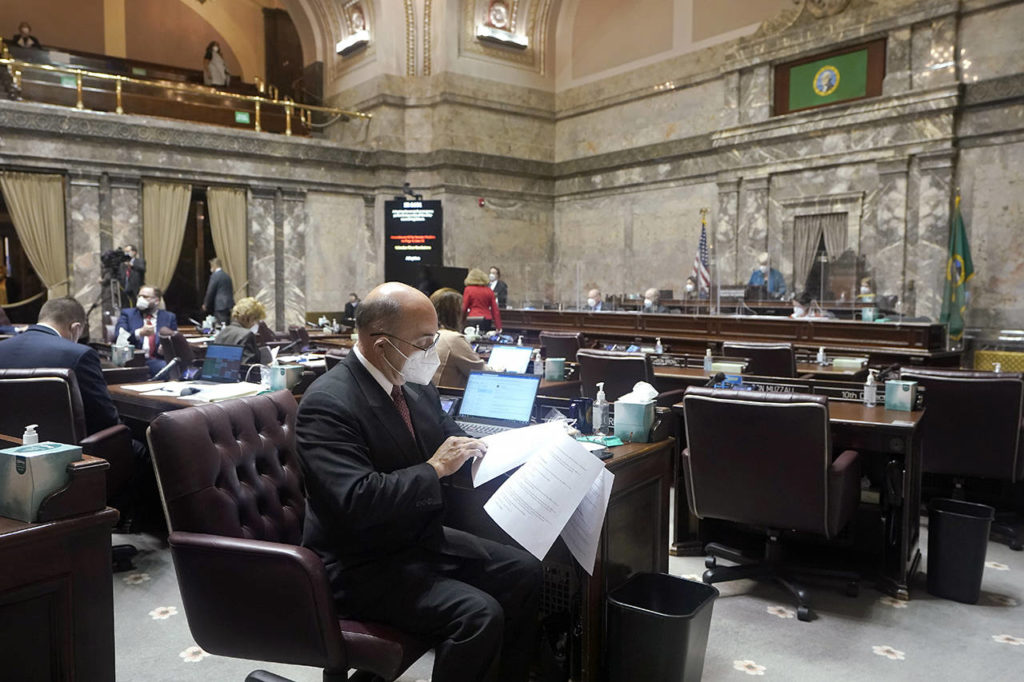 Sen. Keith Wagoner, R-Sedro-Woolley, sits at his desk on the Senate floor Monday at the Capitol in Olympia. (AP Photo/Ted S. Warren)
