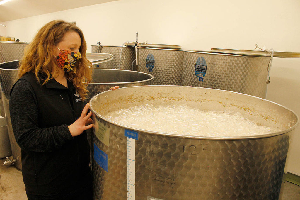 Michelle Scandalis works in Hierophant Meadery, which she runs with Jeremy Kyncl in Freeland. Local honey is a fundamental ingredient in the brews. (Kira Erickson/South Whidbey Record)
