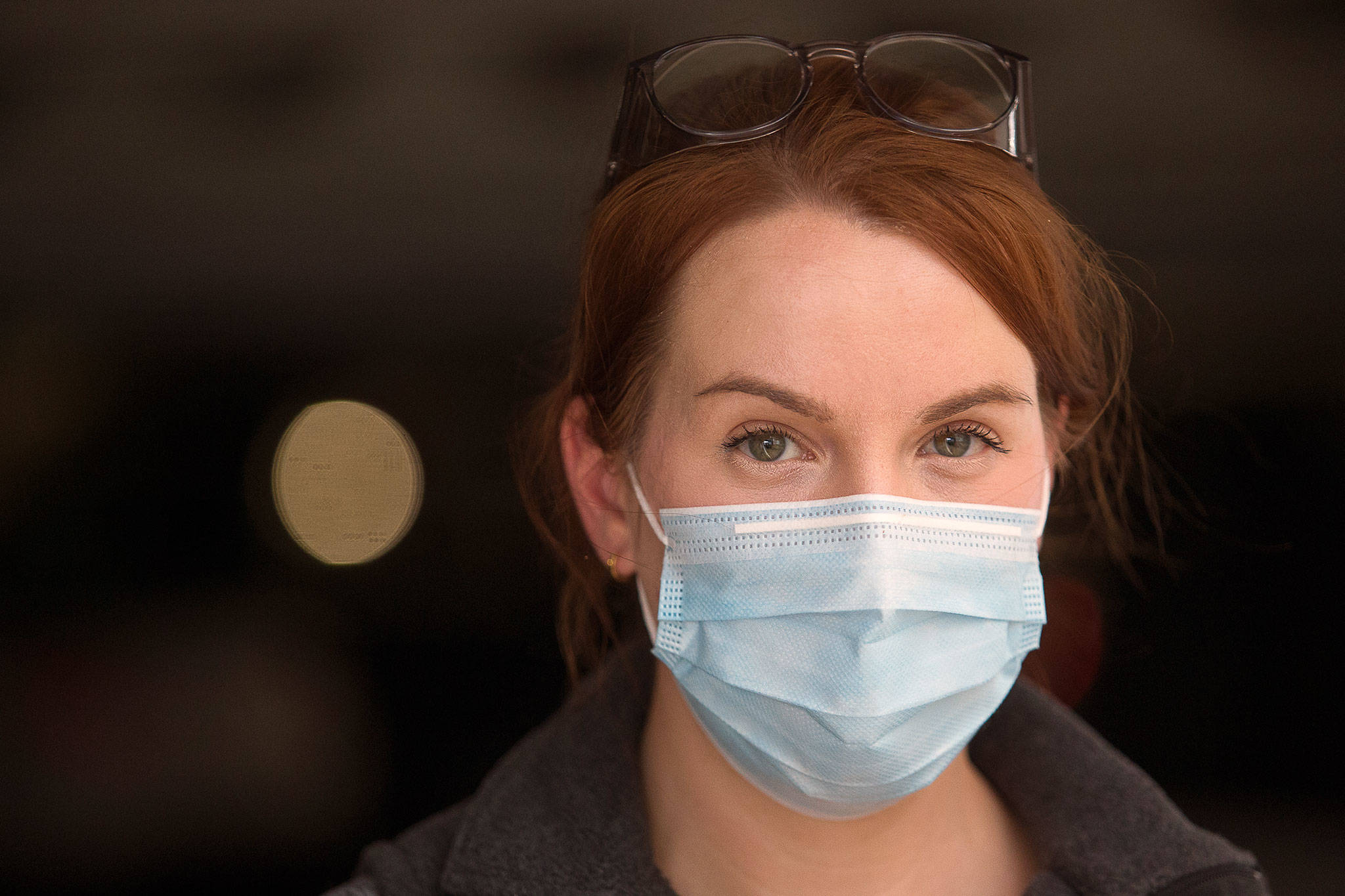 Intensive care unit registered nurse Sara Gering at Providence Regional Medical Center on Jan. 12 in Everett, Washington. A year later, Gering and her co-workers are still enduring the physical and emotional exhaustion that comes with caring for patients with COVID-19. (Andy Bronson / The Herald)