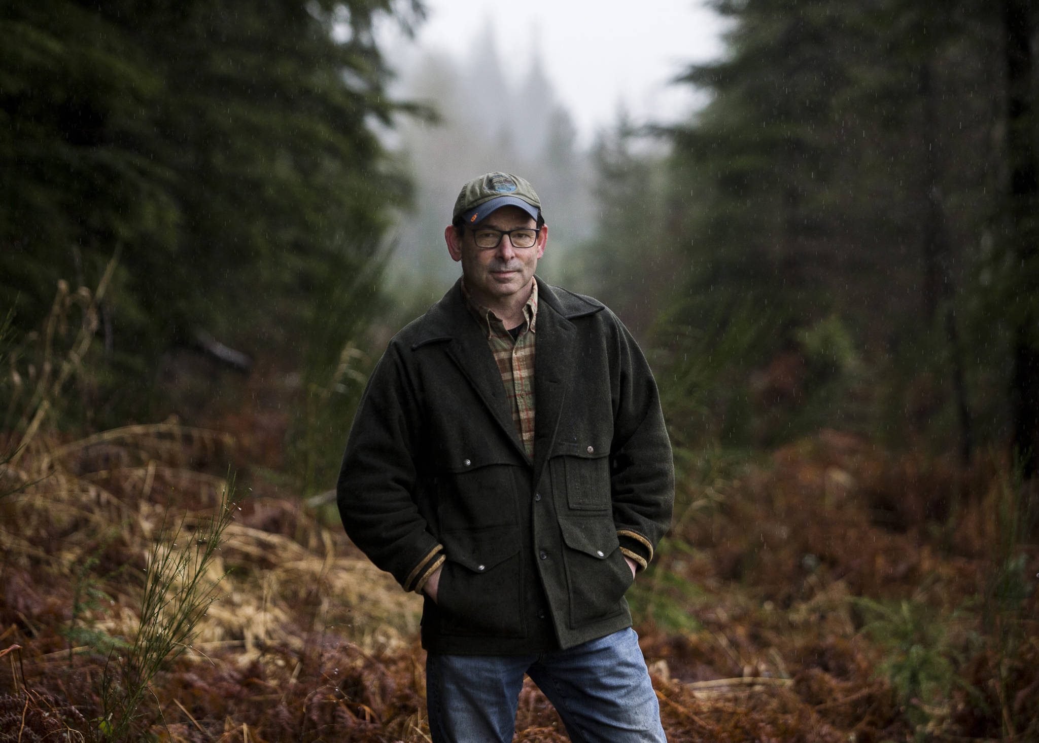 Darrington Mayor Dan Rankin stands alongside land in north Darrington that could potentially be used to build a 30-acre Wood Innovation Center. (Olivia Vanni / The Herald)