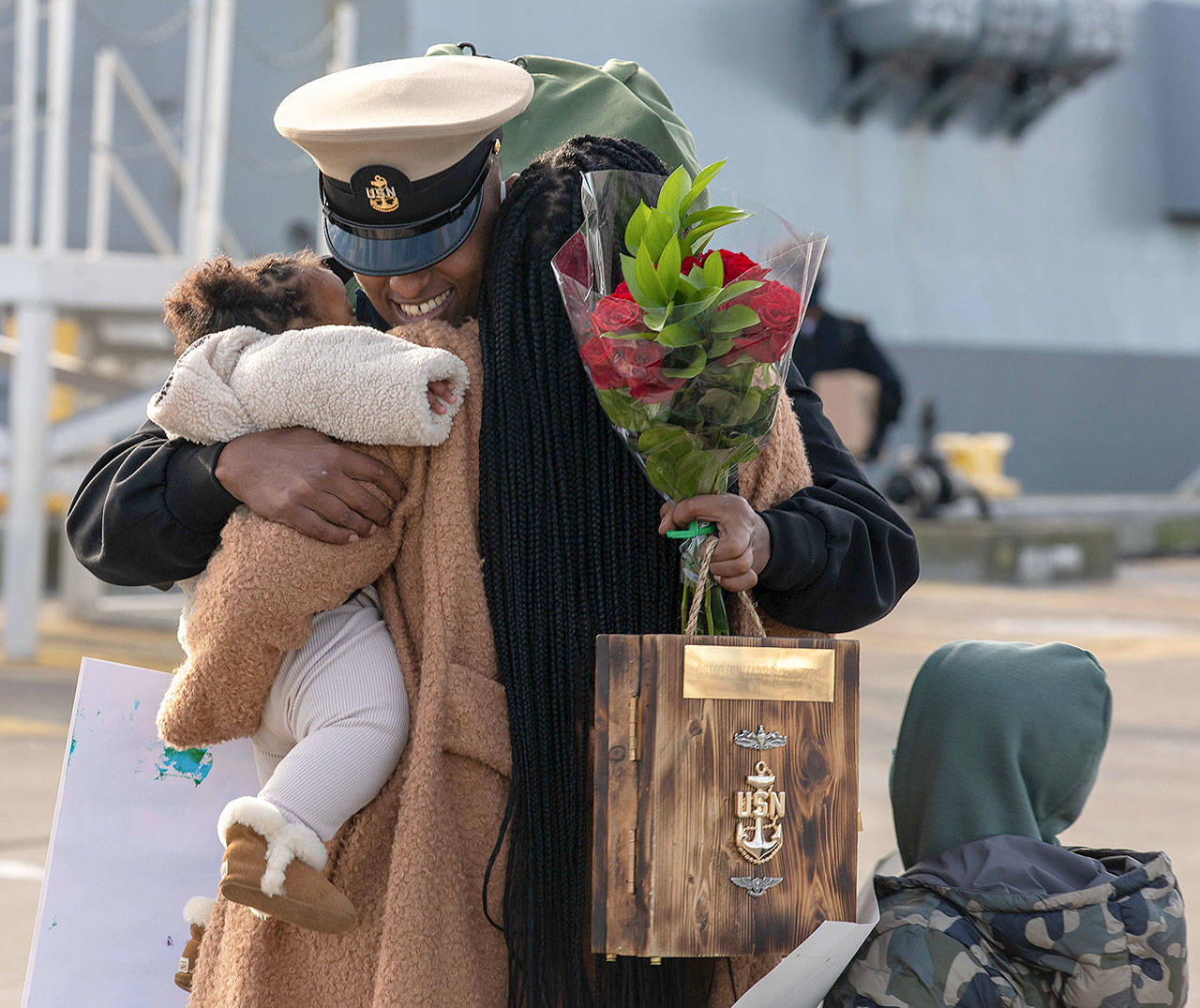 Kirubel Weldeyes reunites with his family at Naval Station Everett Jan. 14, 2021. (U.S. Navy photo by Mass Communication Specialist 3rd Class Ethan J. Soto)