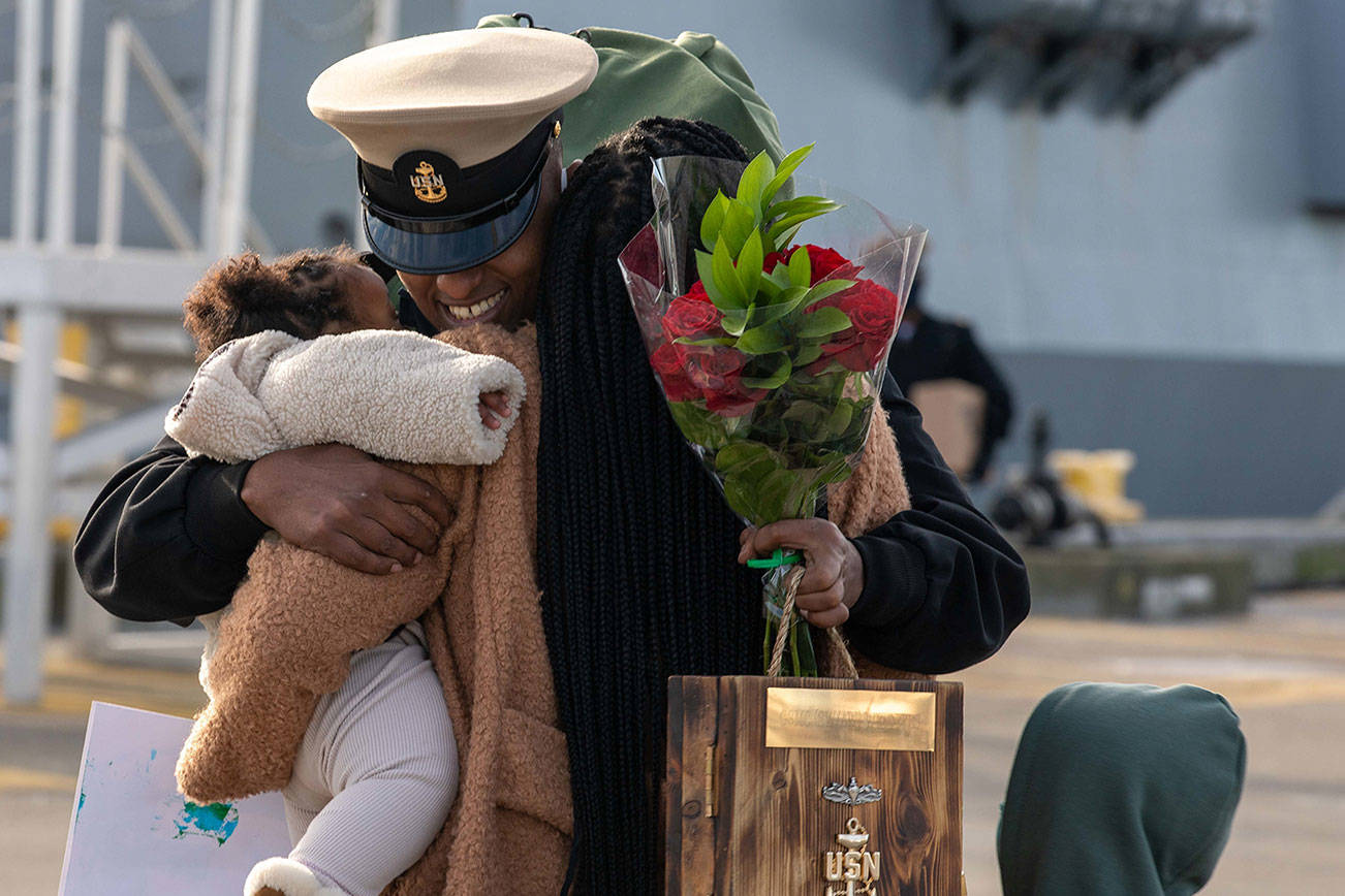 Kirubel Weldeyes reunites with his family at Naval Station Everett Jan. 14, 2021. (U.S. Navy photo by Mass Communication Specialist 3rd Class Ethan J. Soto)