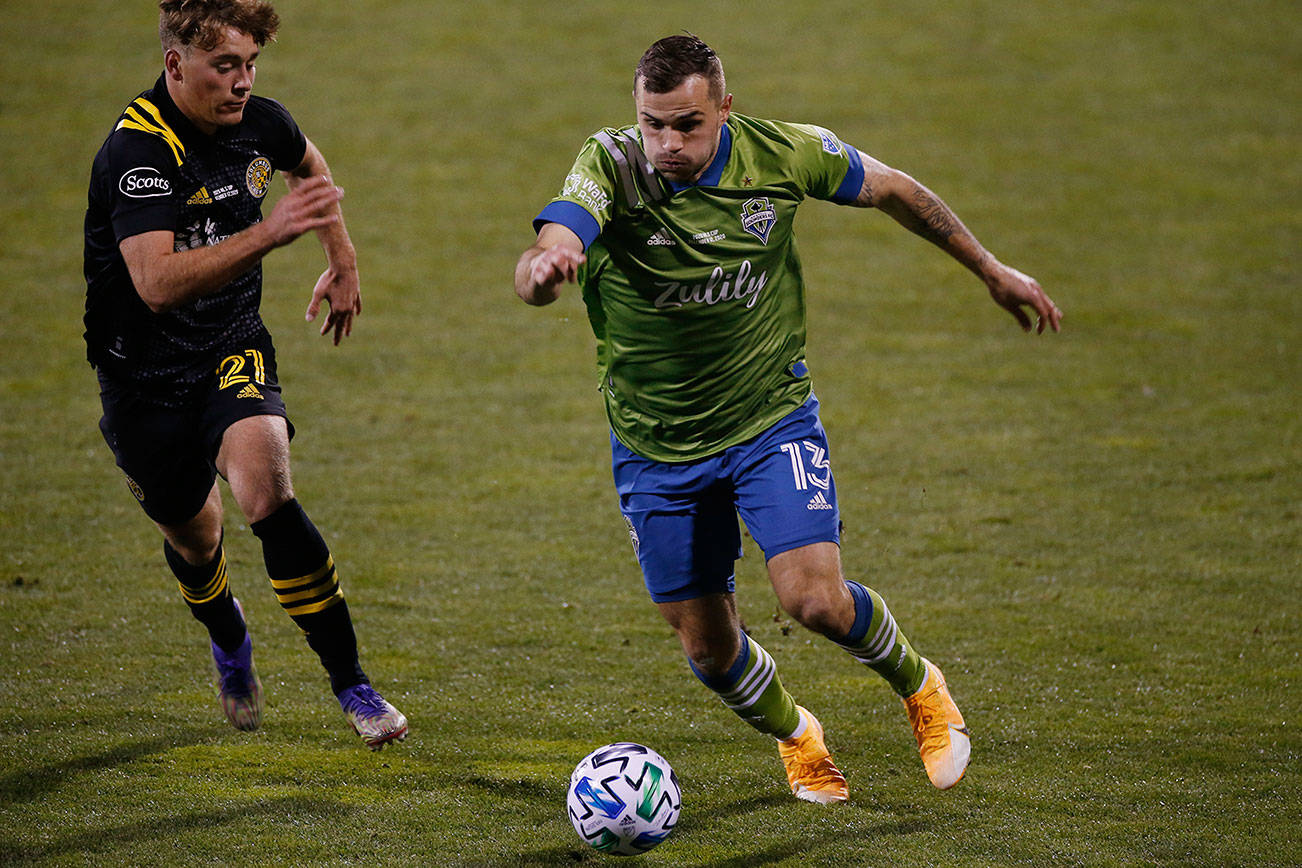 Seattle Sounders' Jordan Morris, right, tries to advance the ball past Columbus Crew's Aidan Morris during the second half of the MLS Cup championship game Saturday, Dec. 12, 2020, in Columbus, Ohio. The Crew won 3-0. (AP Photo/Jay LaPrete)