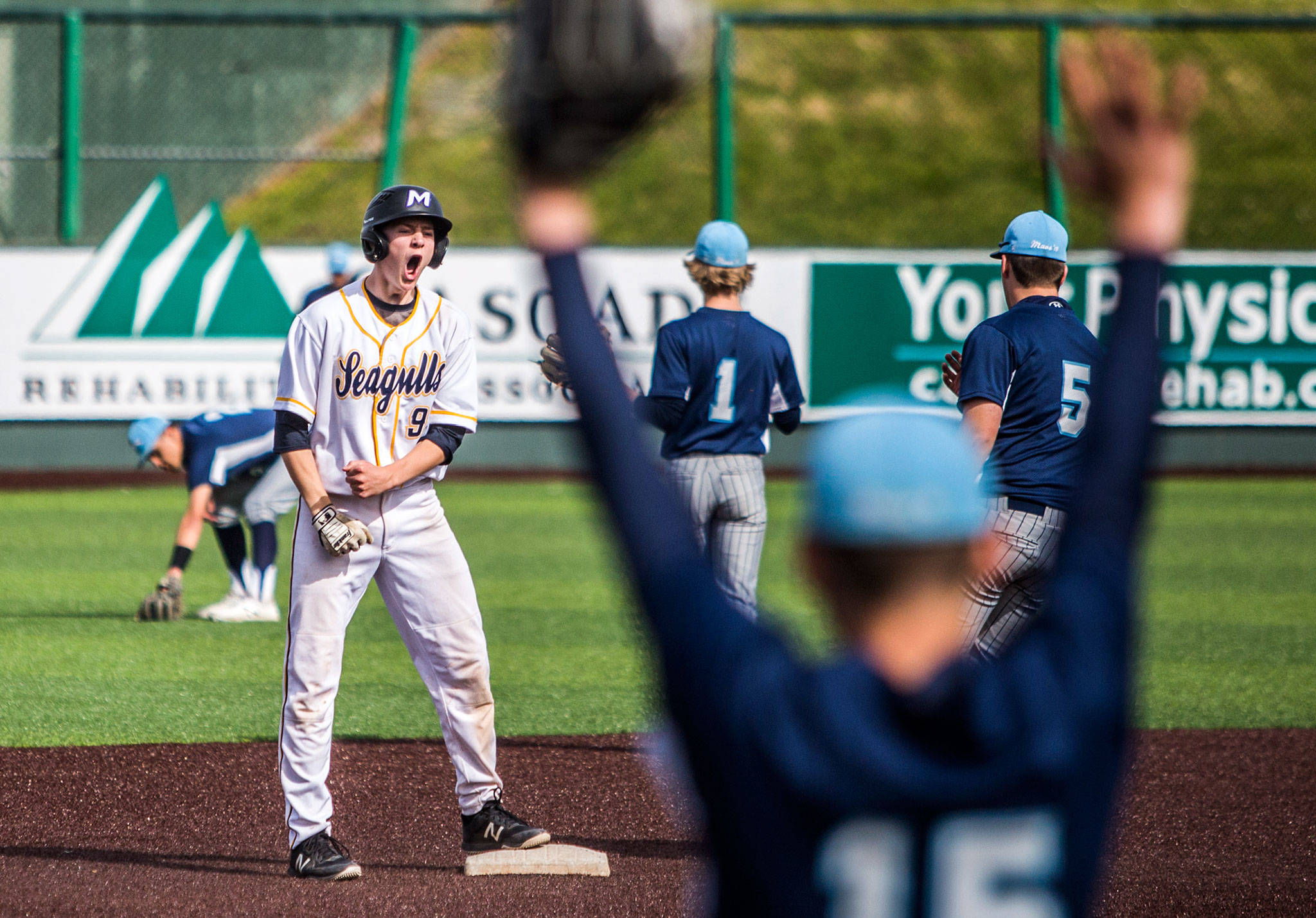 Everett’s Aaron Robertson reacts to hitting a run-scoring double in the first inning of the Seagulls’ 8-4 win over Meadowdale in a Class 3A Northwest District Tournament quarterfinal Saturday at Funko Field at Everett Memorial Stadium. It was the Seagulls’ first postseason victory in nine years. (Olivia Vanni / The Herald)