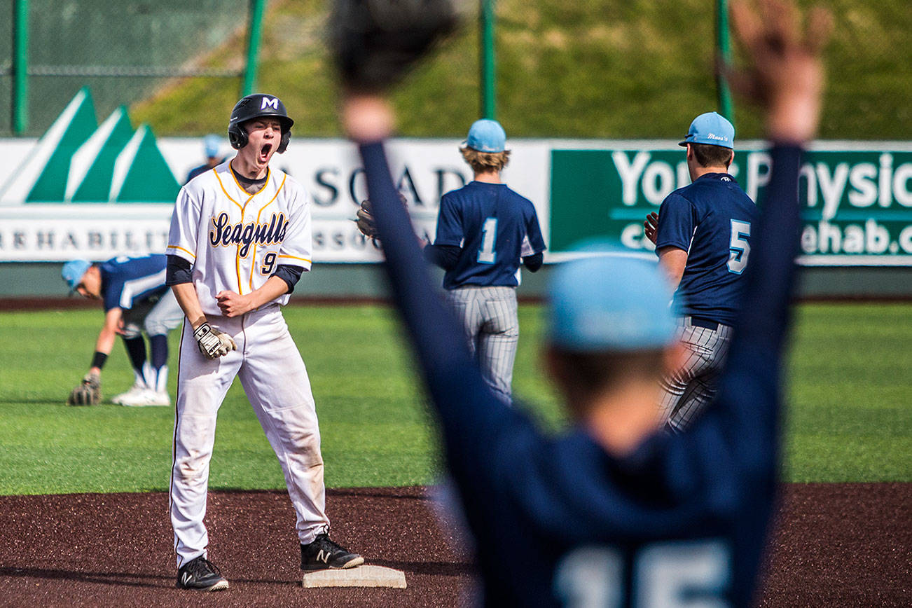 Everett’s Aaron Robertson reacts to hitting a double that advances runners to score during the game against Meadowdale at Funko Field on Saturday, May 4, 2019 in Everett, Wash. (Olivia Vanni / The Herald)