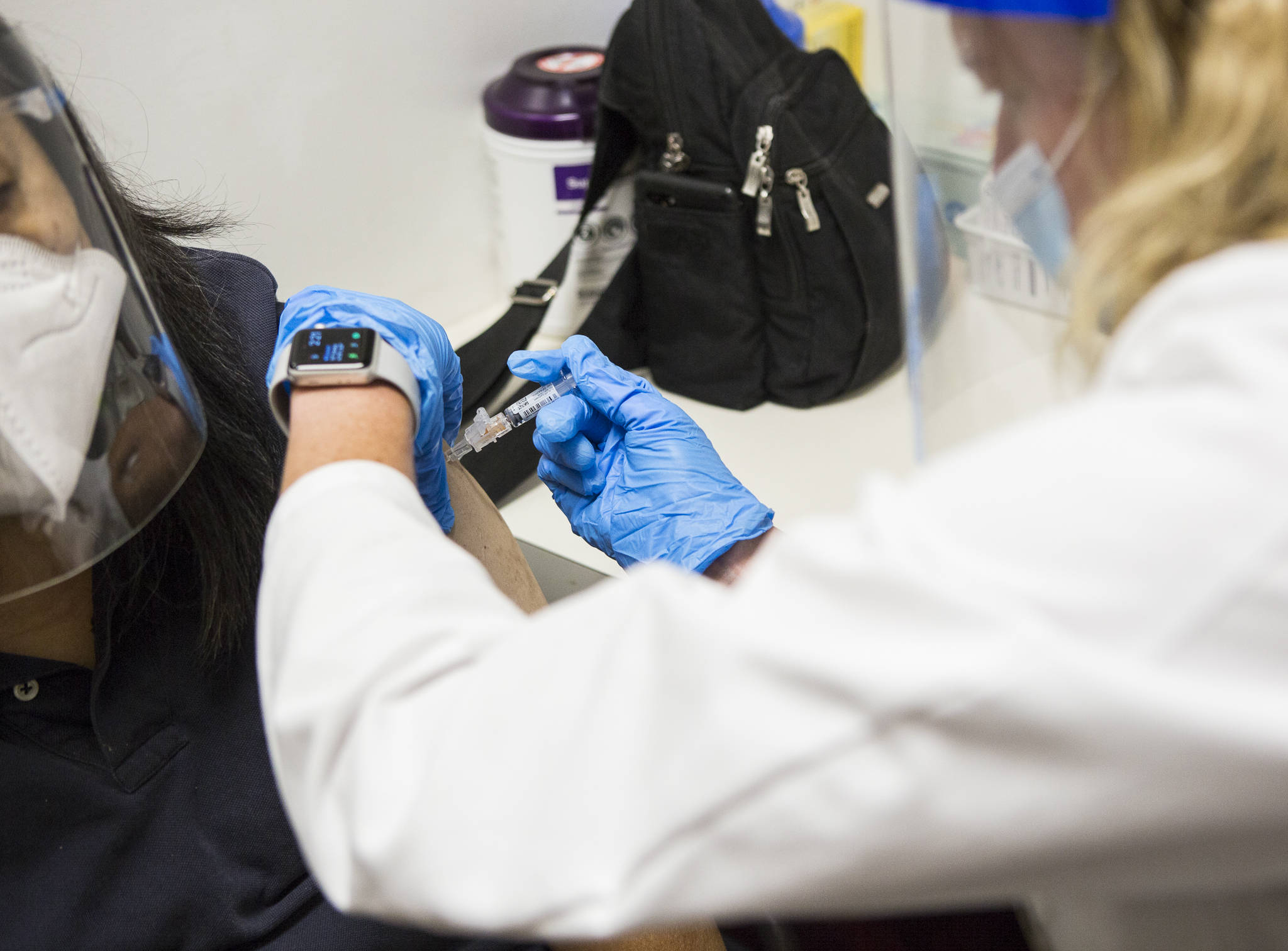 QFC Pharmacist Becky Buerhaus administers a flu shot in September 2020 in Everett. (Olivia Vanni / The Herald)