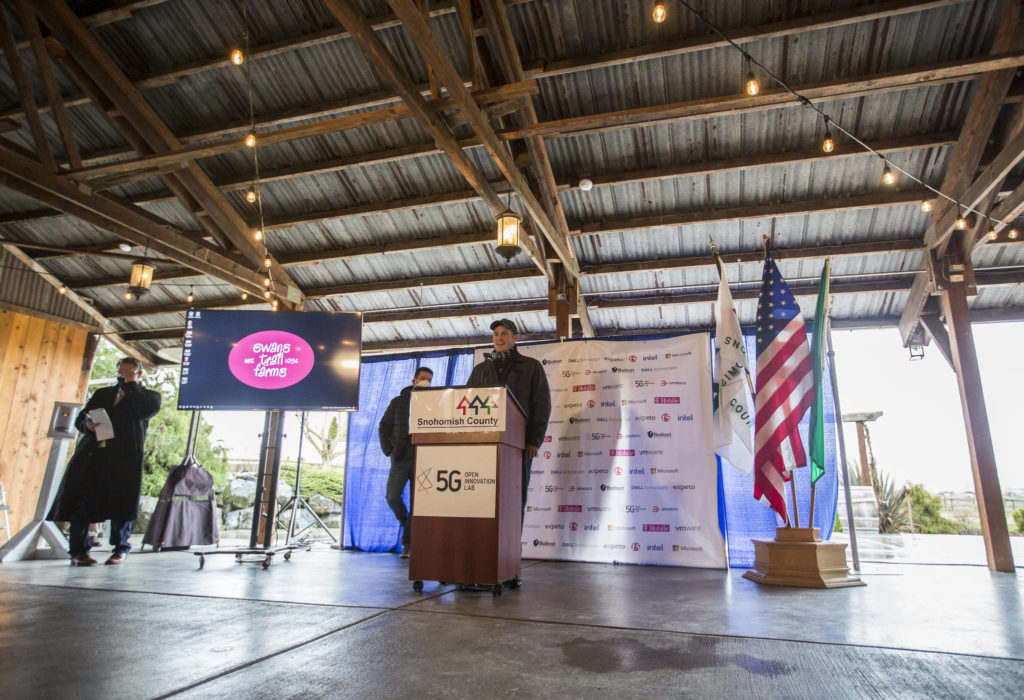 Andrew Albert, owner of Albert Family Farm, speaks at the 5G Open Innovation Lab news conference at Swans Trail Farms on Tuesday in Snohomish. (Olivia Vanni / The Herald) 
