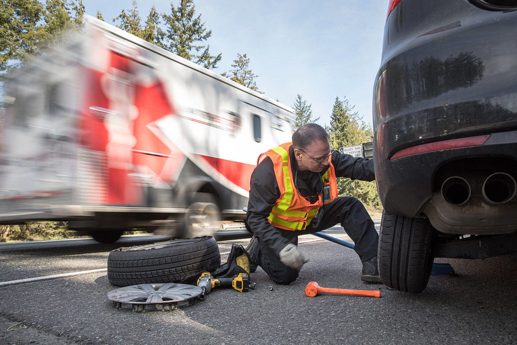 Lizz Giordano / Herald file 
Ken Buretta’s work space is often on the shoulder of I-5, with trucks and cars whizzing by, as seen here March 27, 2019. Buretta is part of the state’s Incident Response Team in Snohomish County which responds to about 8,000 crashes and roadside incidents on state highways per year.
