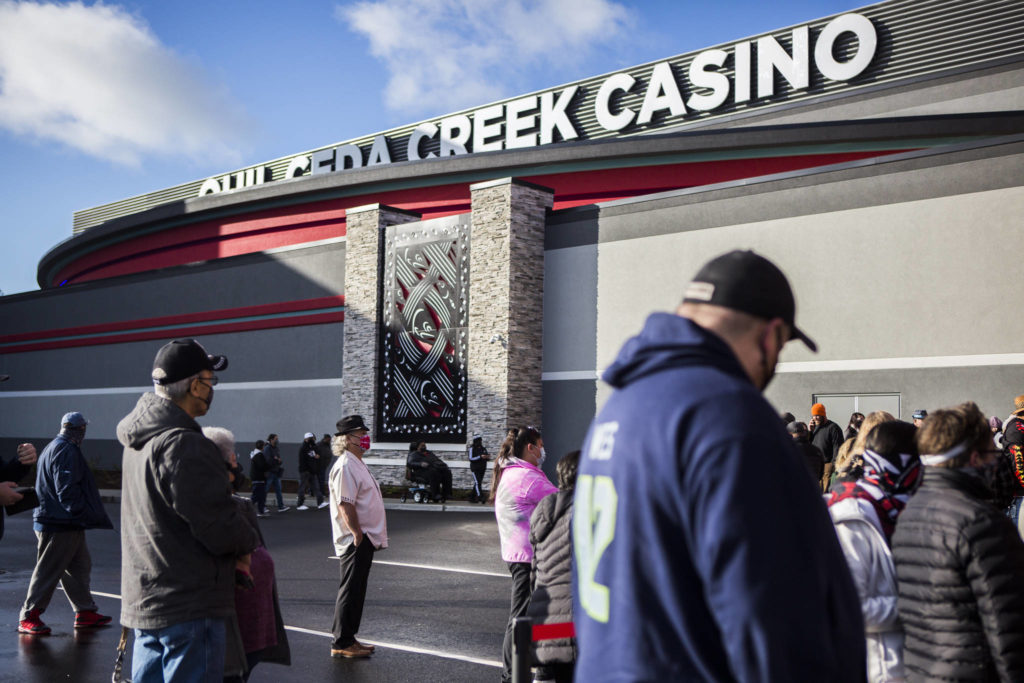 People gather outside the new Quil Ceda Creek Casino for the grand opening on Wednesday in Tulalip. (Olivia Vanni / The Herald)
