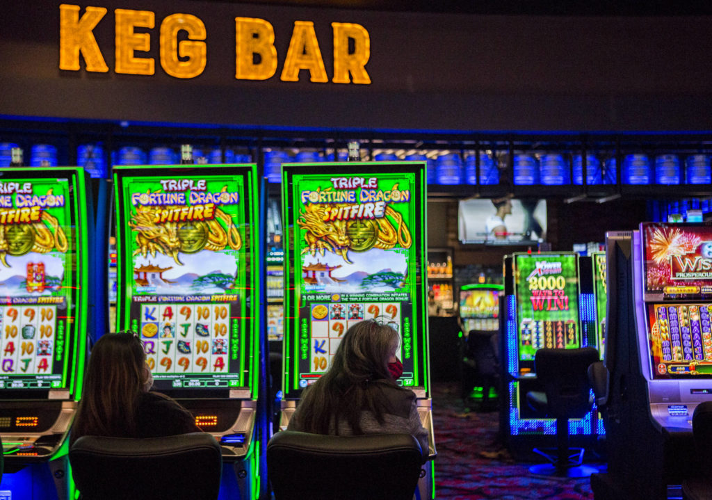 People play slot machines inside the new Quil Ceda Creek Casino on Wednesday in Tulalip. (Olivia Vanni / The Herald)
