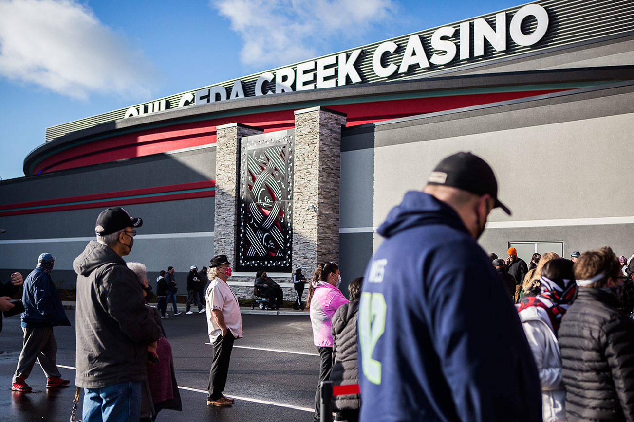 People gather outside of the new Quil Ceda Creek Casino during the grand opening ceremony on Wednesday, Feb. 3, 2020 in Tulalip, Wa. (Olivia Vanni / The Herald)