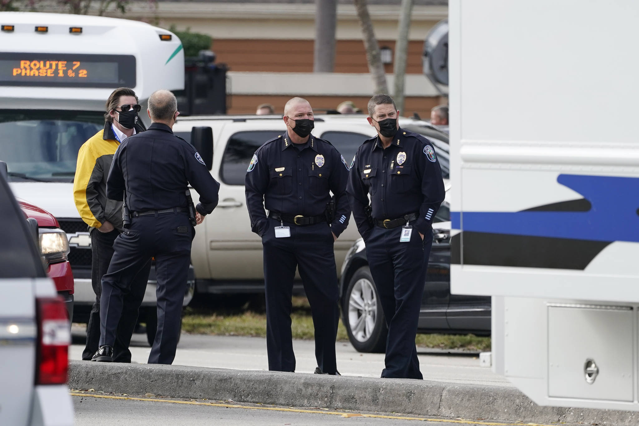 Law enforcement officers block an area where a shooting wounded several FBI agents while serving an arrest warrant, Tuesday, Feb. 2, 2021, in Sunrise, Fla. (AP Photo/Marta Lavandier)