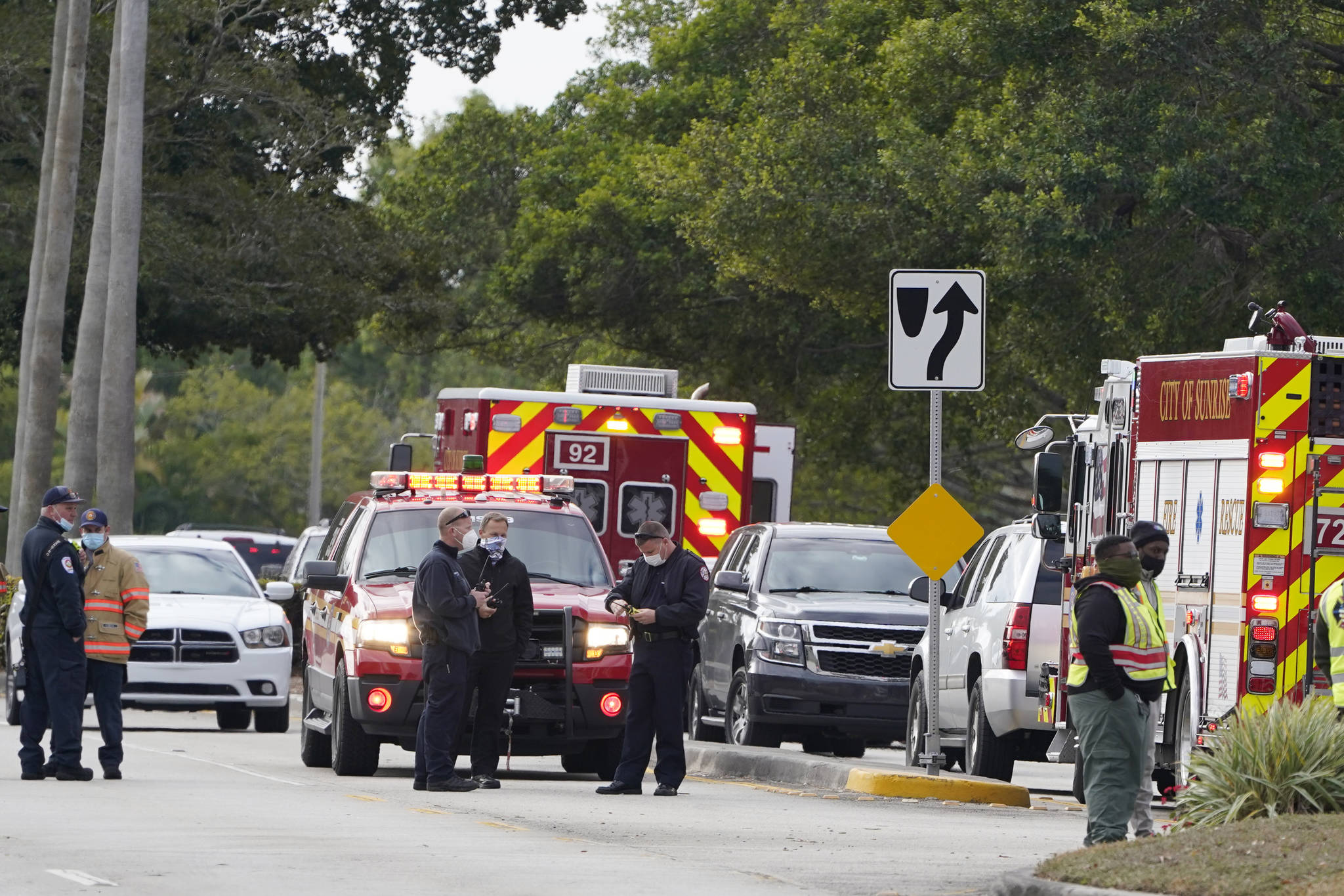 Law enforcement officers block an area where a shooting wounded several FBI while serving an arrest warrant, Tuesday, Feb. 2, 2021, in Sunrise, Fla. (AP Photo/Marta Lavandier)