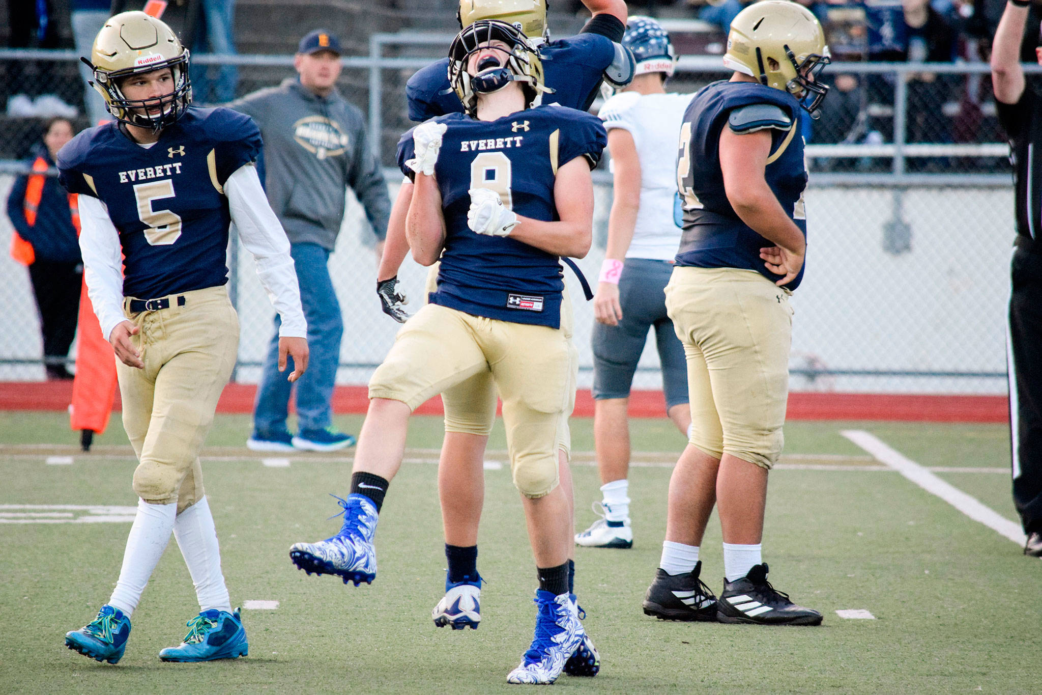 Everett’s Cavan Campbell celebrates after making a defensive stop during a game against Meadowdale on Oct. 11, 2019, at Everett Memorial Stadium. (Katie Webber / The Herald)