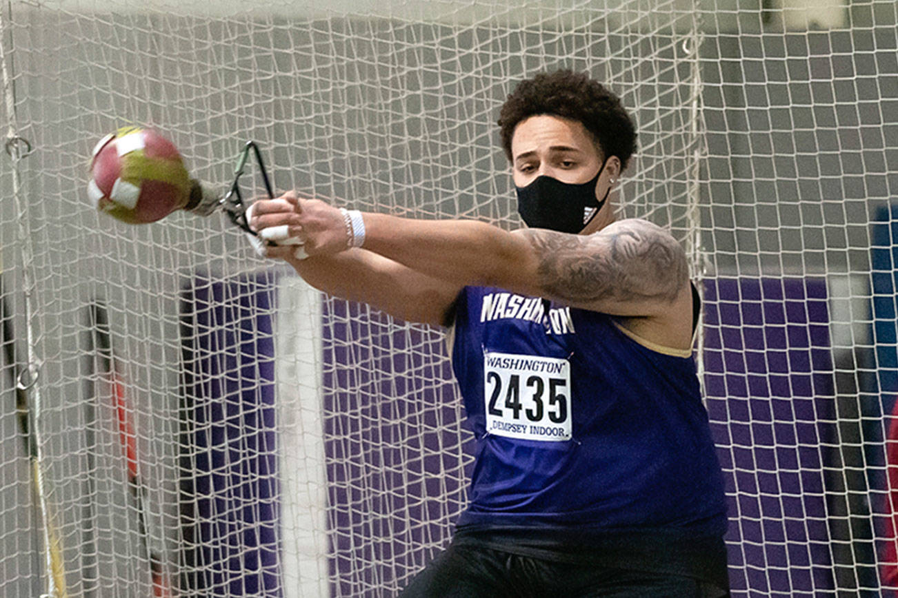 Washington freshman Jayden White, an Everett High School graduate, throws a weight during the UW Indoor Preview on Jan. 29, 2021, in Seattle. (Photo by Jamie Mitchell)