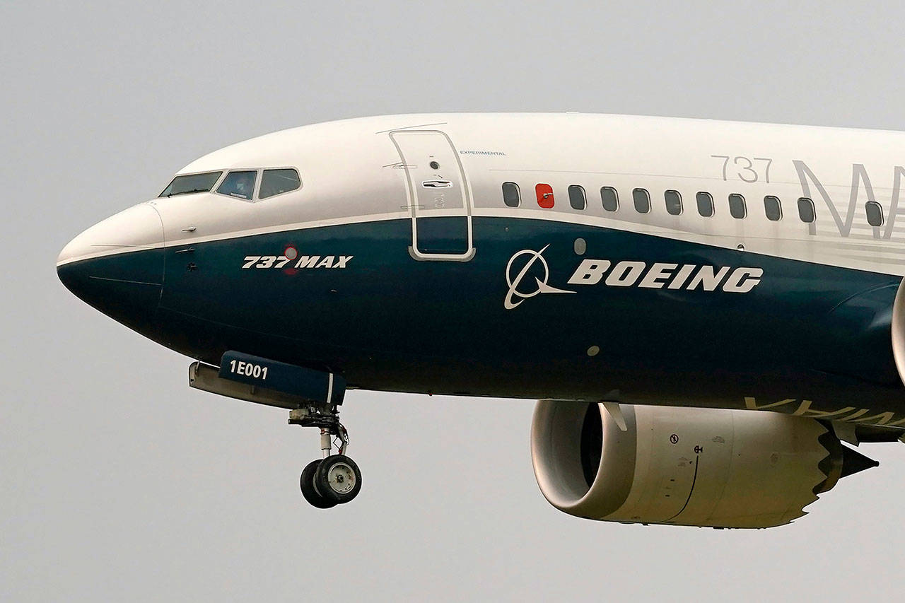 A Boeing 737 MAX jet prepares to land at Boeing Field following a test flight in Seattle on Sept. 3o, 2020. (AP Photo/Elaine Thompson, File)