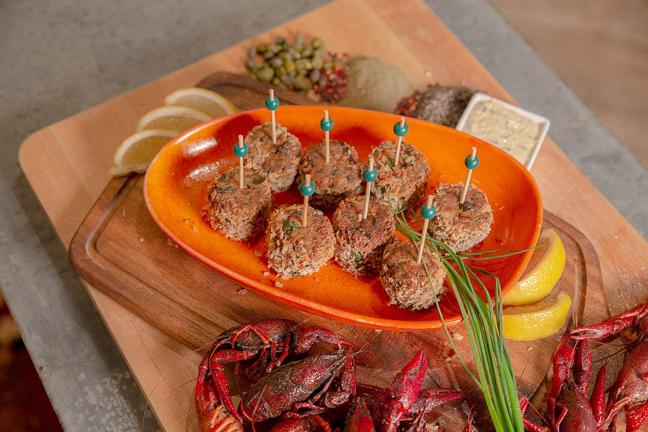 Serve Mardi Gras crawfish cakes with lemon wedges and a garlic-caper remoulade. (Tulalip Resort Casino)