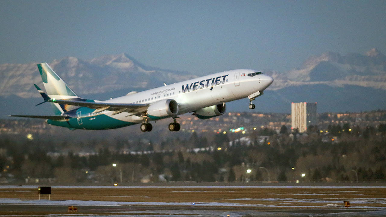 In this Jan. 21 photo, the first commercial flight of the Boeing 737 Max in Canada since the aircraft was cleared to fly again in Canadian airspace lifts off in Calgary. (Jeff McIntosh/The Canadian Press via AP, File)