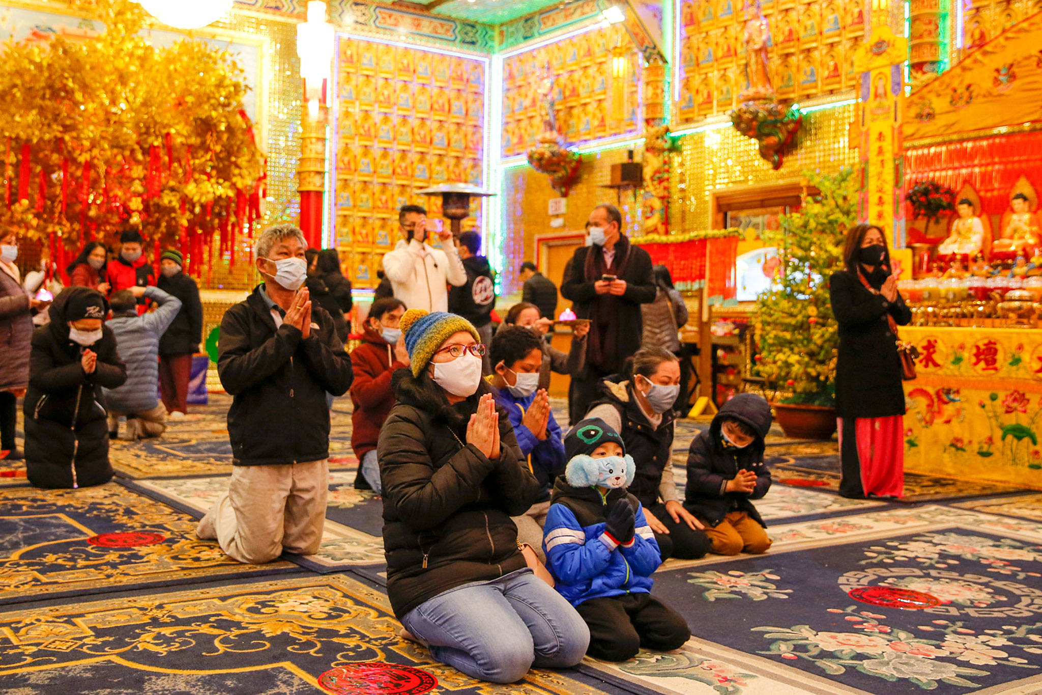 People gathered to offer prayers and wishes for Lunar New Year at Dia Tang Temple in Lynnwood on Friday. (Kevin Clark / The Herald)