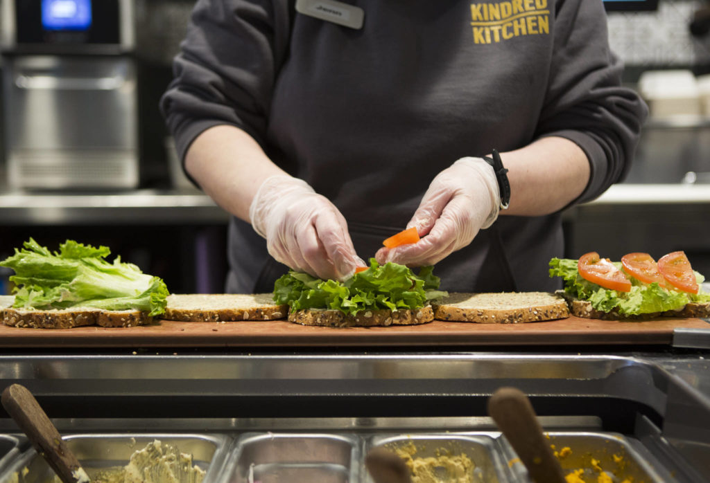 Sandwiches are prepped for delivery at the Kindred Kitchen on Friday in Everett. (Olivia Vanni / The Herald)
