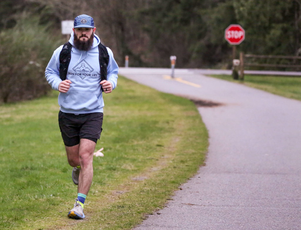 Austin Johnson, 26, trains on the Centennial Trail in Lake Stevens and is planning to do a 24-hour run to raise money for the American Foundation for Suicide Prevention. (Kevin Clark / The Herald)
