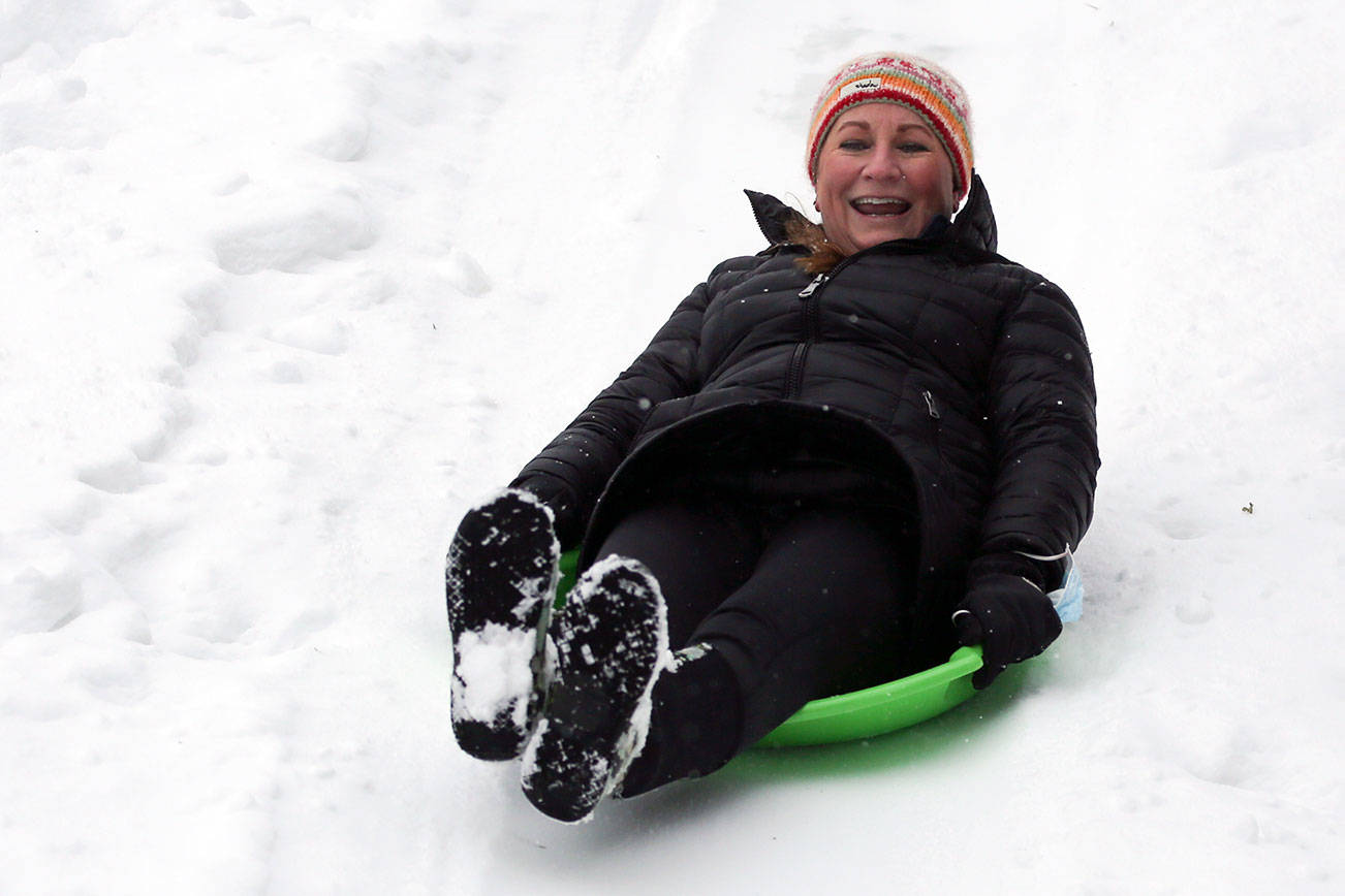 Jody Gasperetti races down a hill at Edmonds City Park  Saturday afternoon on February 13, 2021.  (Kevin Clark / The Herald)