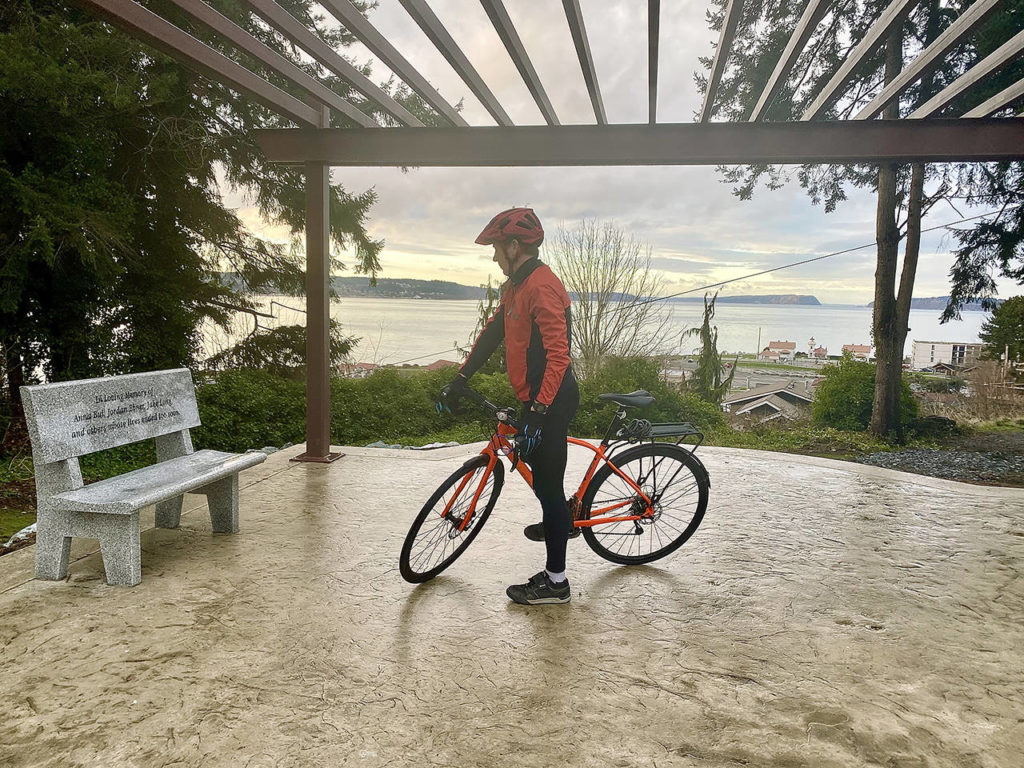 David Culler takes a break from a bike ride at Byers Family Park, also known as Peace Park, that offers a scenic overlook of the Mukilteo waterfront. (Andrea Brown / The Herald)
