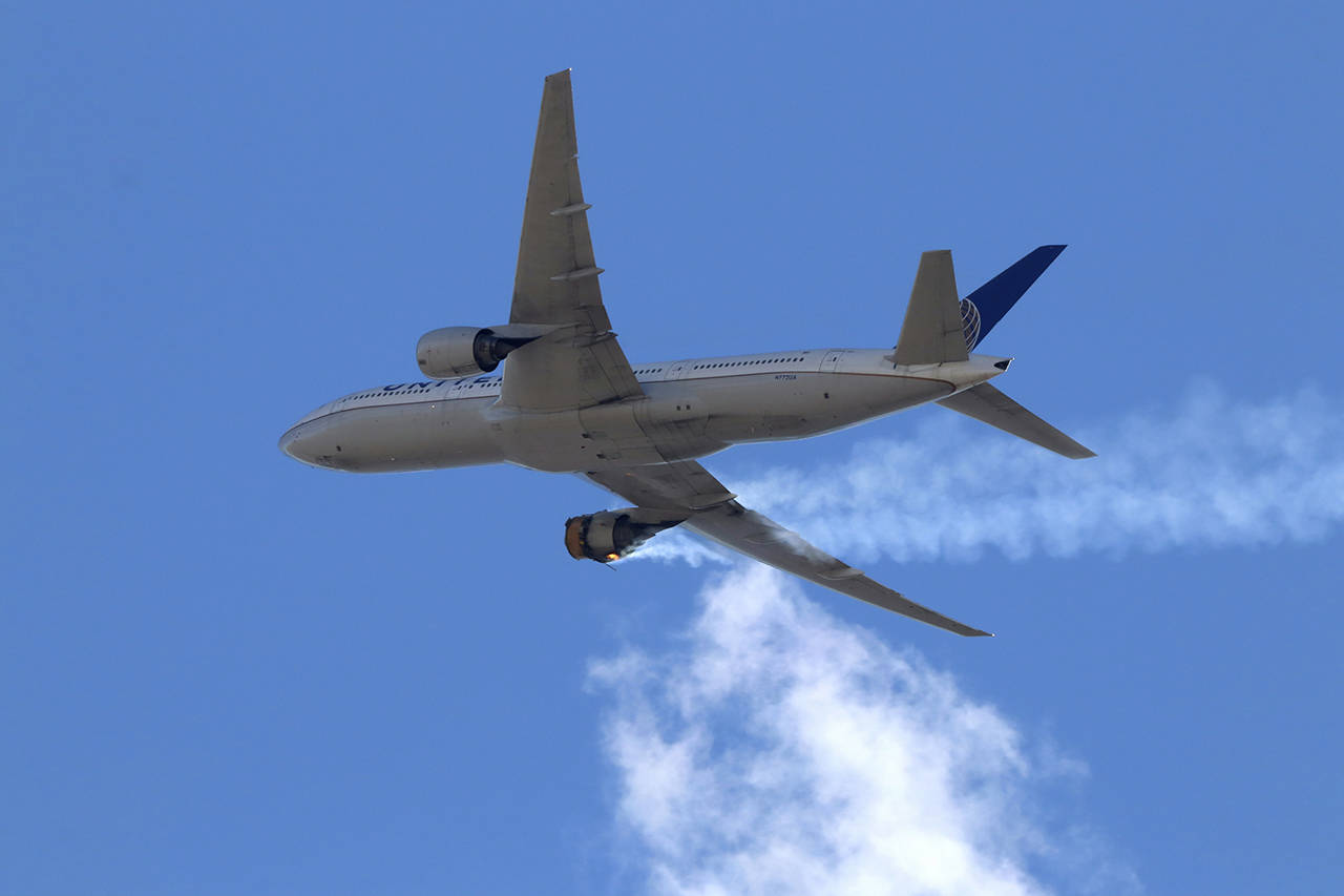 This Saturday photo shows United Airlines Flight 328 approaching Denver International Airport, after experiencing “a right-engine failure” shortly after takeoff from Denver. (Hayden Smith via AP)