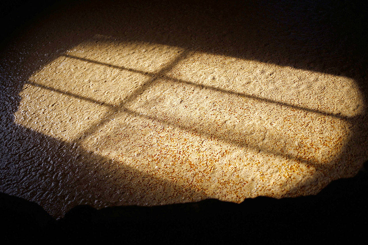 Bourbon mash sits at a distillery in Versailles, Kentucky. (Bloomberg News photo by Luke Sharrett)