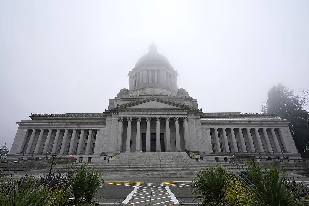 The Legislative Building is shown partially shrouded in fog at the Capitol in Olympia on Jan. 7. A federal COVID relief bill on its way to its first vote in Congress would bring about $10 billion to Washington. (AP Photo/Ted S. Warren, File)