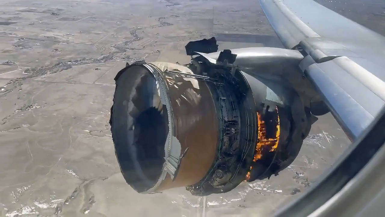 In this image taken from video, the engine of United Airlines Flight 328 is on fire after after experiencing “a right-engine failure” shortly after takeoff from Denver International Airport on Saturday in Denver. (Chad Schnell via AP)