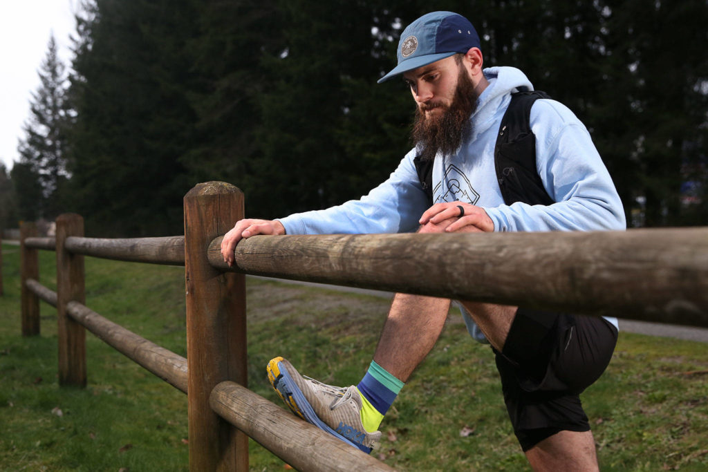 Austin Johnson trains on the Centennial Trail in Lake Stevens. (Kevin Clark / The Herald)
