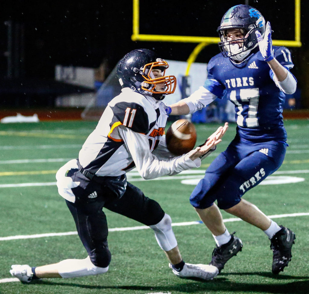 Granite Falls’ Riley Hoople hauls in a reception against Sultan’s Derek Feltner. (Kevin Clark / The Herald)
