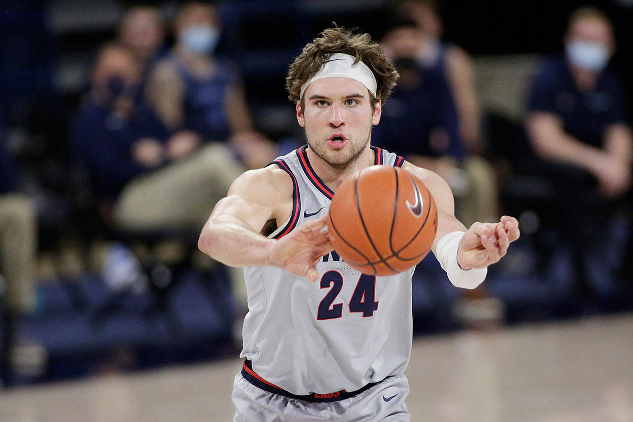 Gonzaga forward Corey Kispert passes the ball during the second half of an NCAA college basketball game against San Diego in Spokane, Wash., Saturday, Feb. 20, 2021. (AP Photo/Young Kwak)