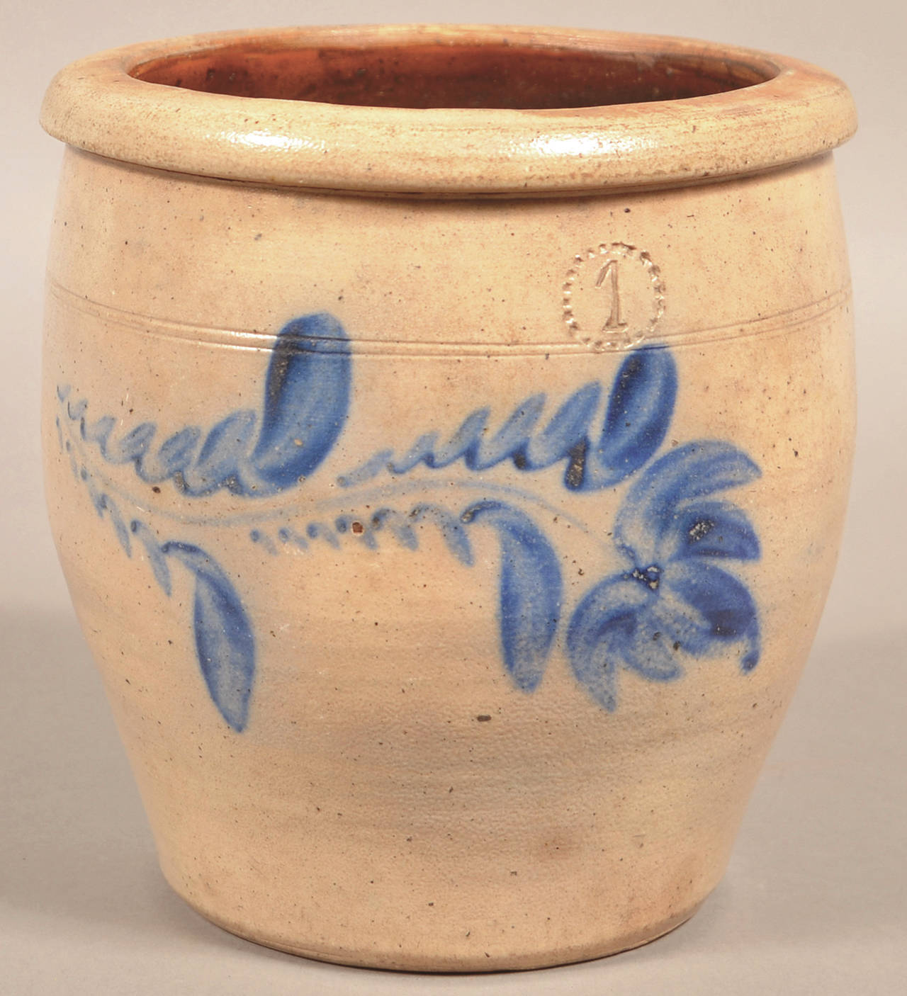 This 1-gallon stoneware crock has the impressed mark of Daniel Shenfelder pottery, proving it was made about 1870 in Pennsylvania. (Cowles Syndicate Inc.)