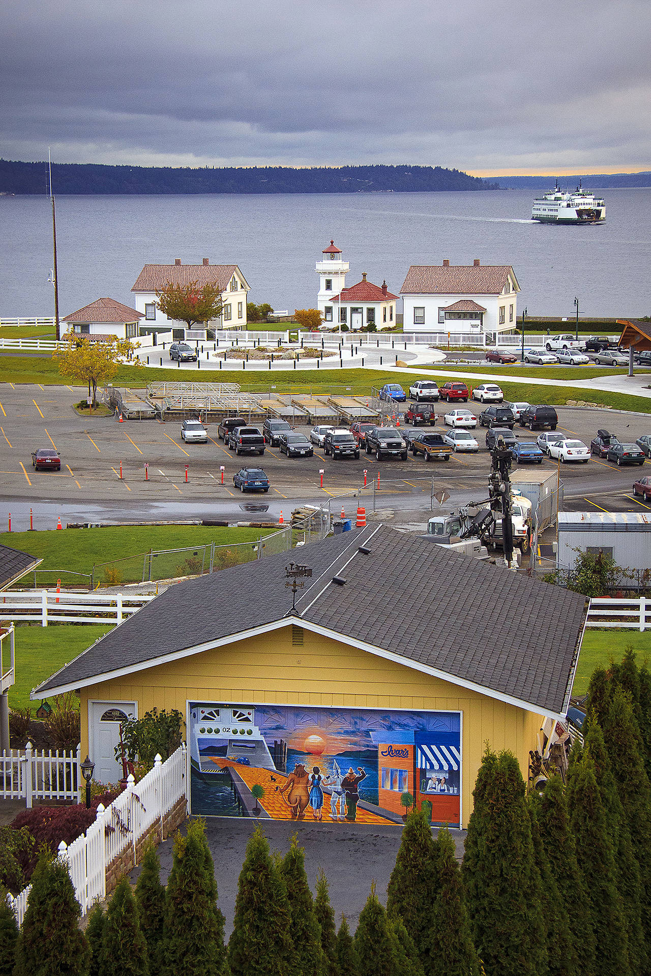 The mural painted on a garage door in Mukilteo in 2009 is seen mainly from the Mukilteo Speedway overpass sidewalk. (David Welton/This is Whidbey)