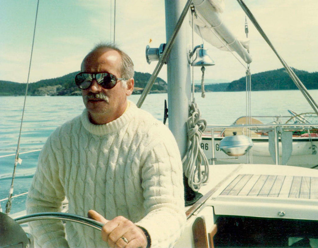 Gary Parks sits at the helm of his 41-foot sailboat not long before his death in 1987. (Family photo)
