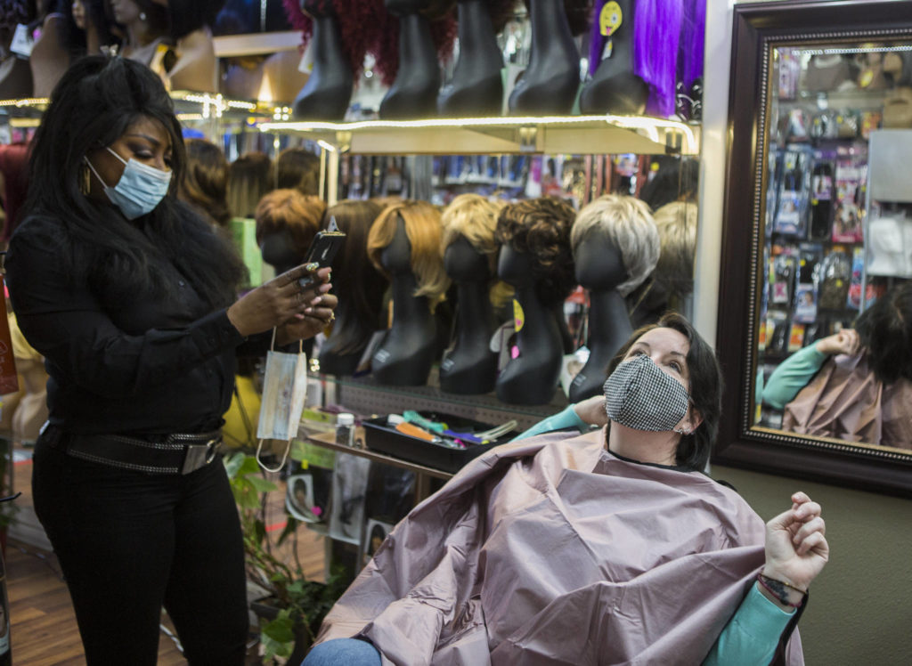 Hope Hottemdorf poses for a “before picture” before getting extensions at Decarla’s Beauty Supply Salon in Everett. (Olivia Vanni / The Herald)
