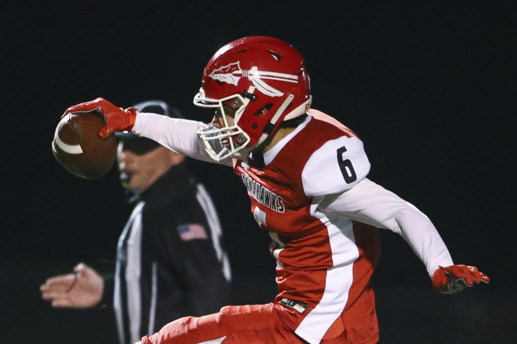 A Marysville Pilchuck football player sported an image of a spear on his helmet when the Tomahawks took on Snohomish in the Wesco 3A Championship at Quil Ceda Stadium on Nov. 1, 2019. School district leaders might soon need to consider dropping Marysville Pilchuck High School’s nickname, the Tomahawks. (Kevin Clark / Herald file)
