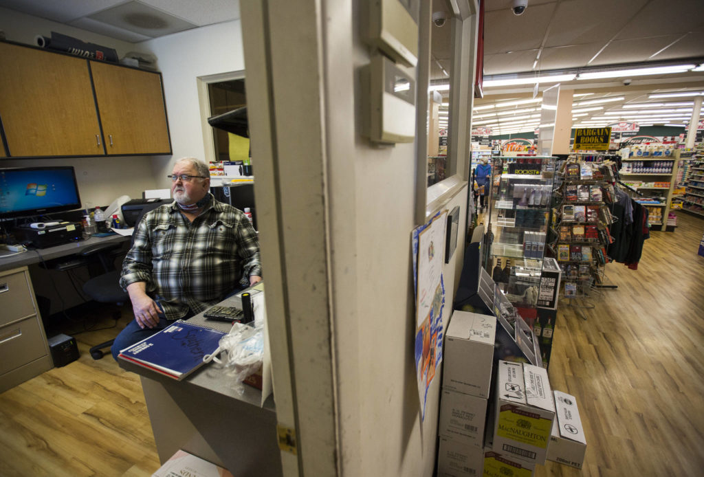 Randy Ashe works in the front office of the IGA in Darrington. (Olivia Vanni / The Herald)
